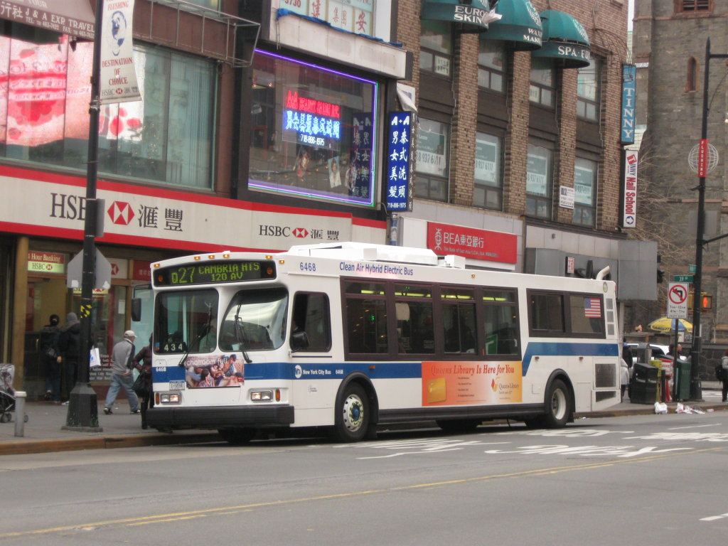 passengers boarding a city bus on a busy street